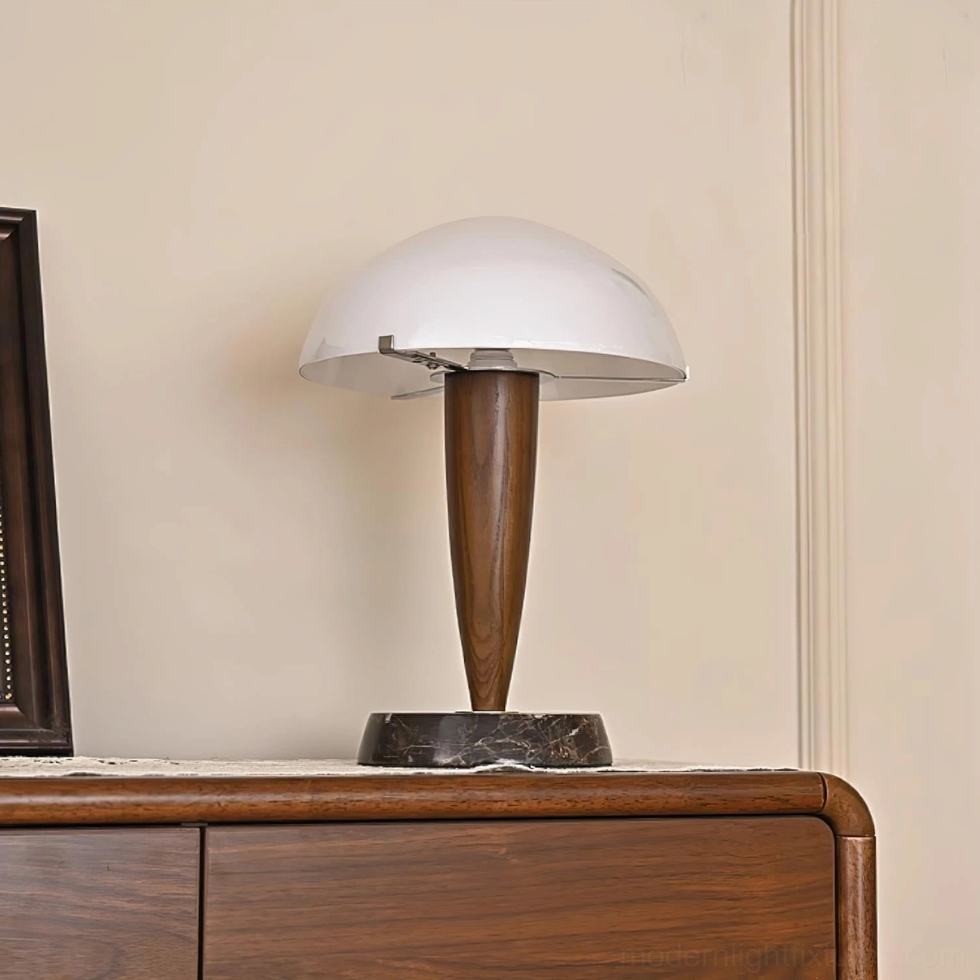 Modern marble table lamp showing frosted glass dome shade design and push-button switch integrated on wooden stem