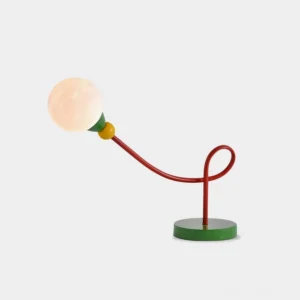 Vitan modern table lamp with bold red curved metal arm and green base, front studio view