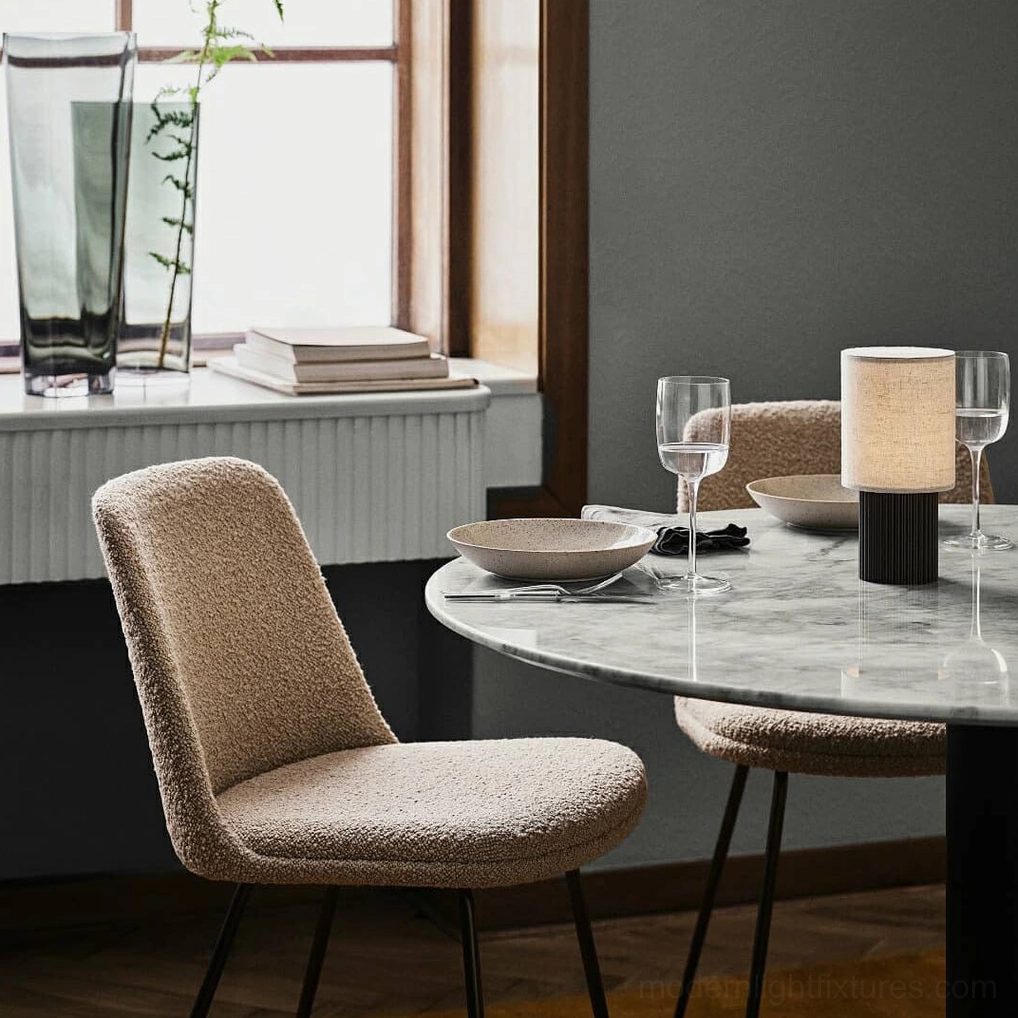 Modern table lamp detail view showing integrated LED technology and built-in USB charging port base, premium metal and fabric material construction