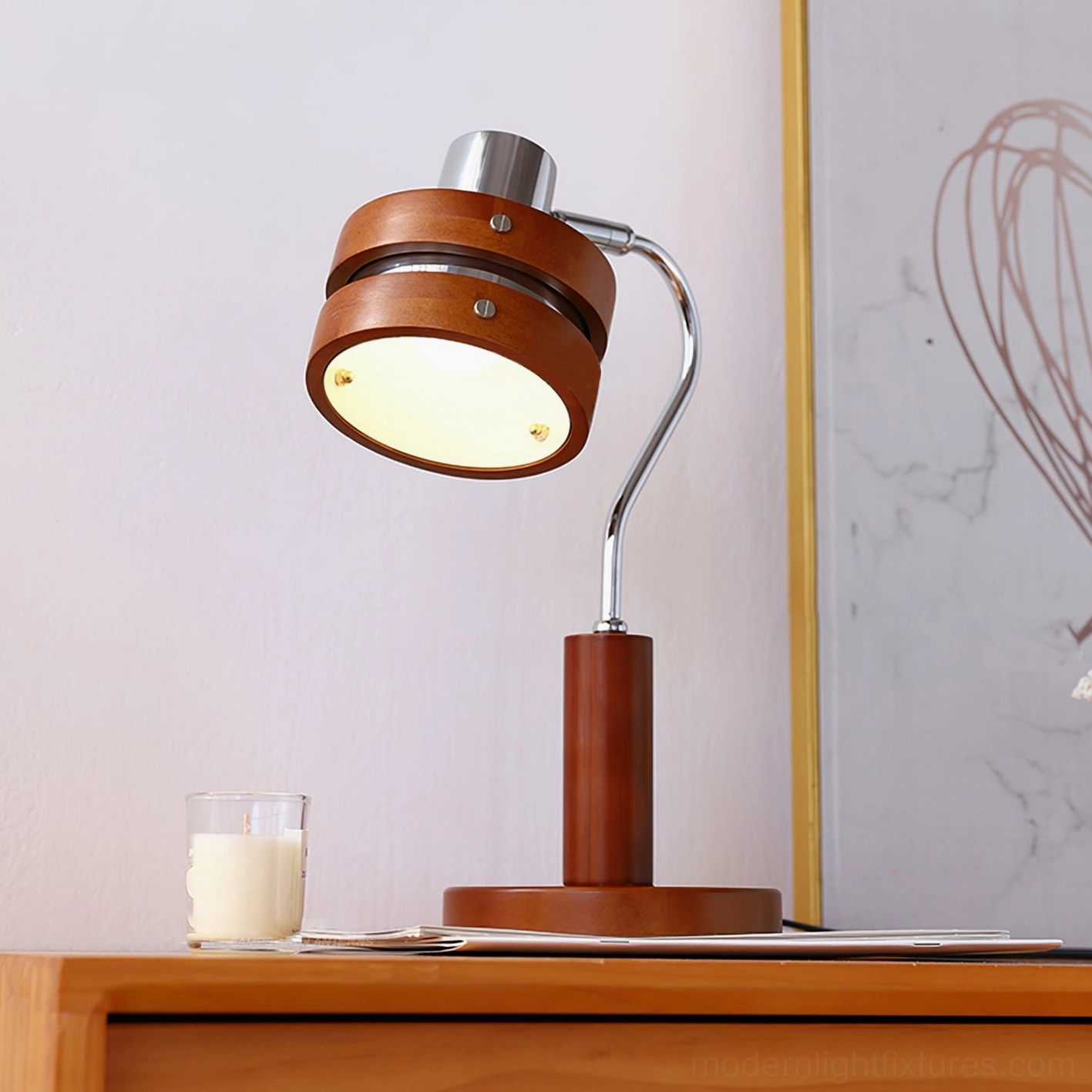 Lit industrial modern table lamp positioned on bedside table emitting warm light, side three-quarter view
