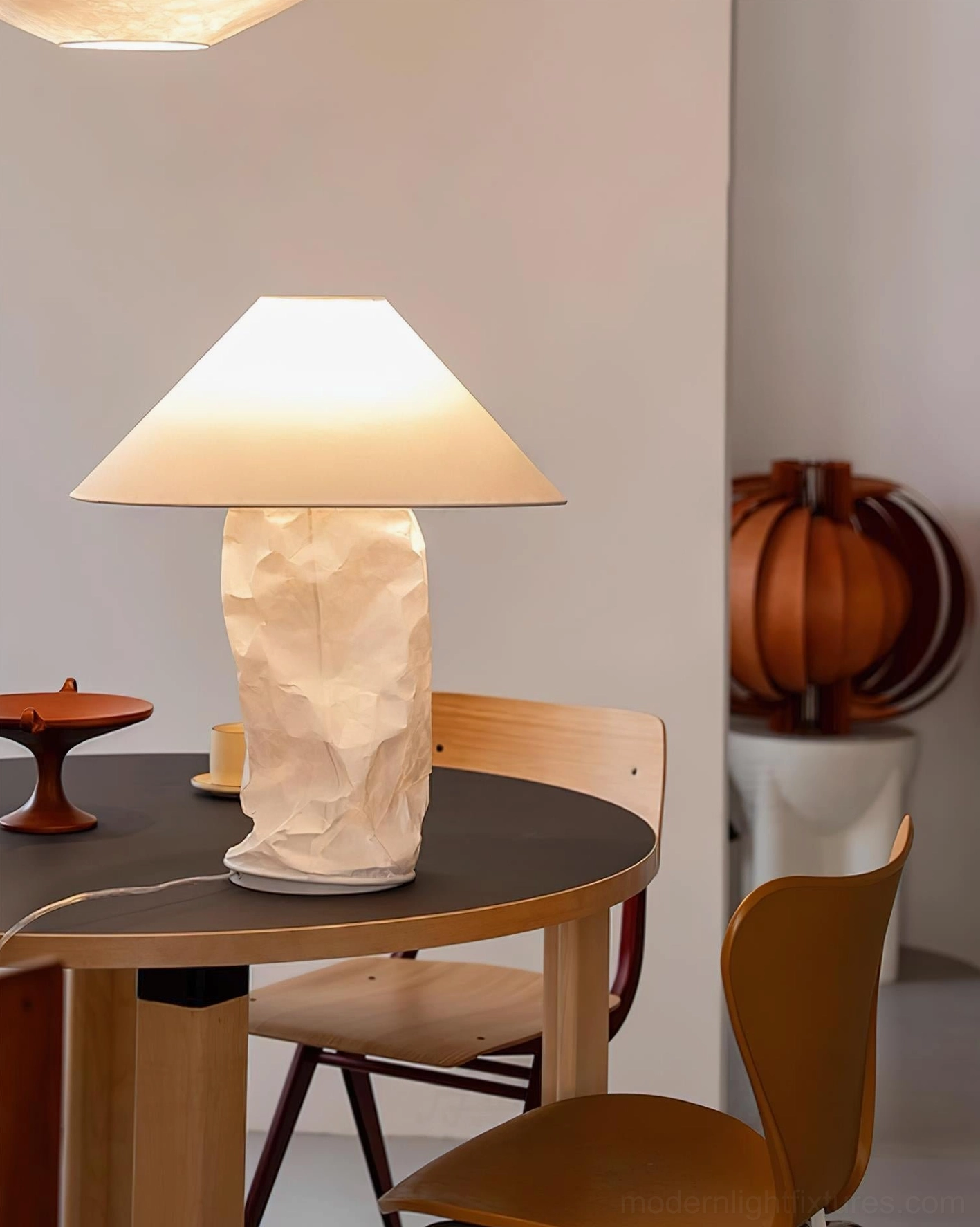 Modern sculptural table lamp base with wood accents in wabi-sabi interior design