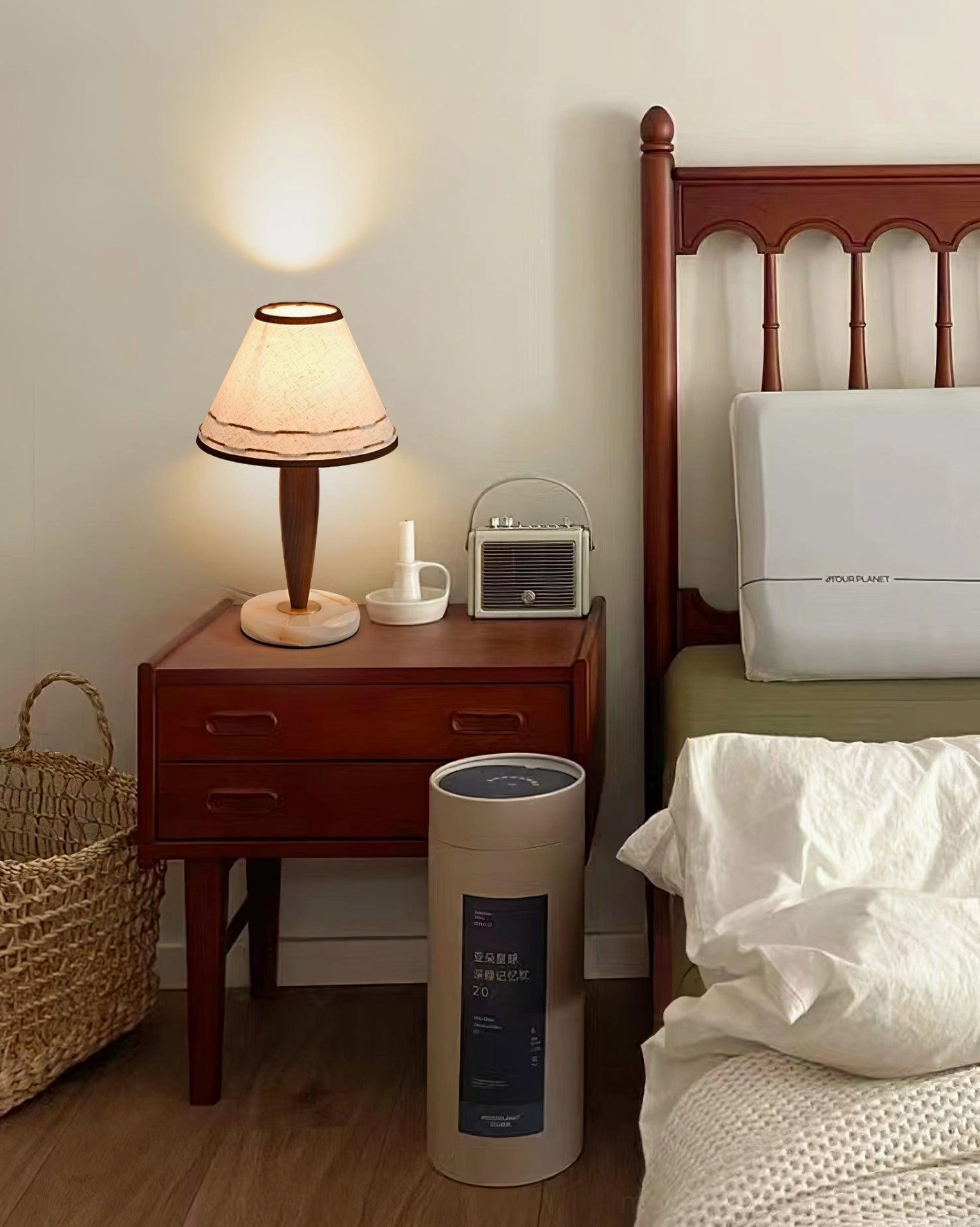 Contemporary terracotta and ash wood lamp in bedroom with retro radio - warm ambient glow
