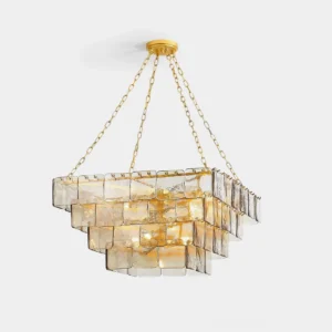 Modern tiered amber glass chandelier with gold framework - front three-quarter view showing sculpted square panels