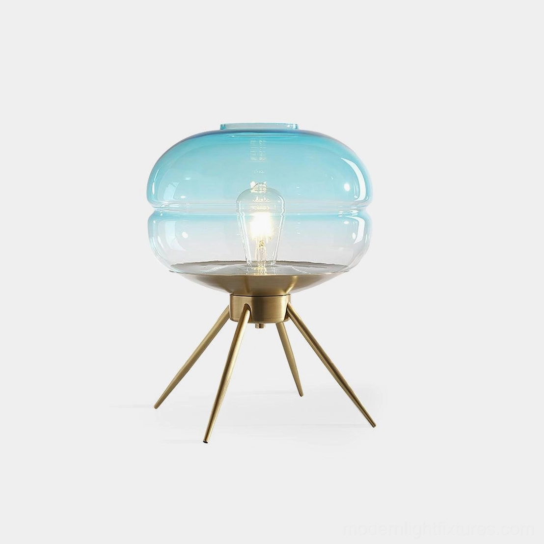 Moda modern tiered glass table lamp with gradient blue shade and brass base, front view on white background