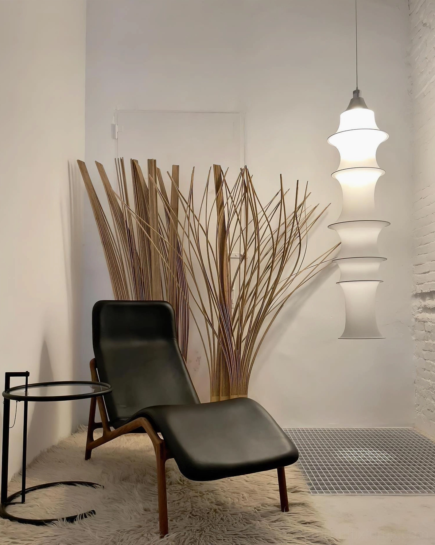 Modern tiered pendant fixture with warm glowing illumination and geometric form