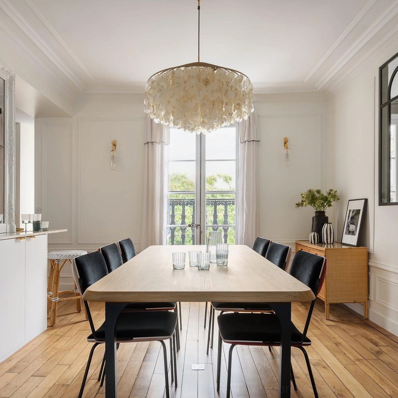 Modern tiered shell chandelier architectural detail with metal frame and translucent shells