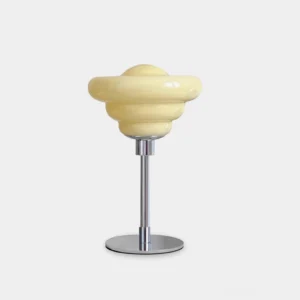 Creamy yellow tiered UFO modern table lamp with polished chrome base, frontal product view on white background