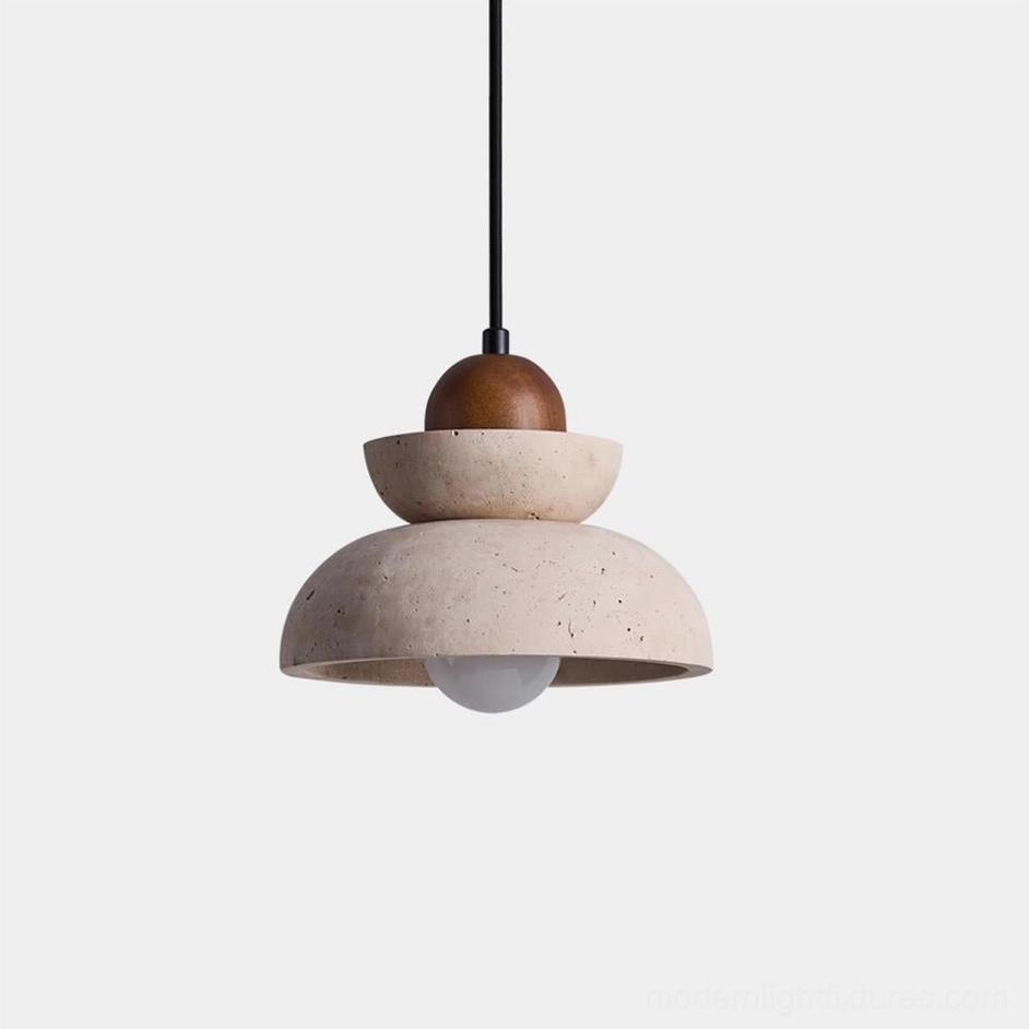 Modern travertine and walnut pendant light with stacked stone shades and black metal rod on white background