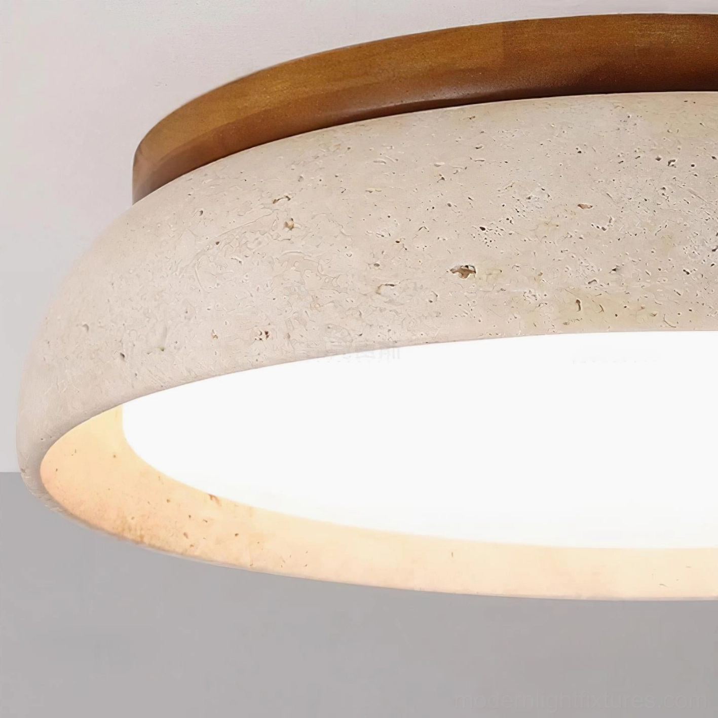 Modern travertine stone ceiling light showing architectural presence and sculptural quality