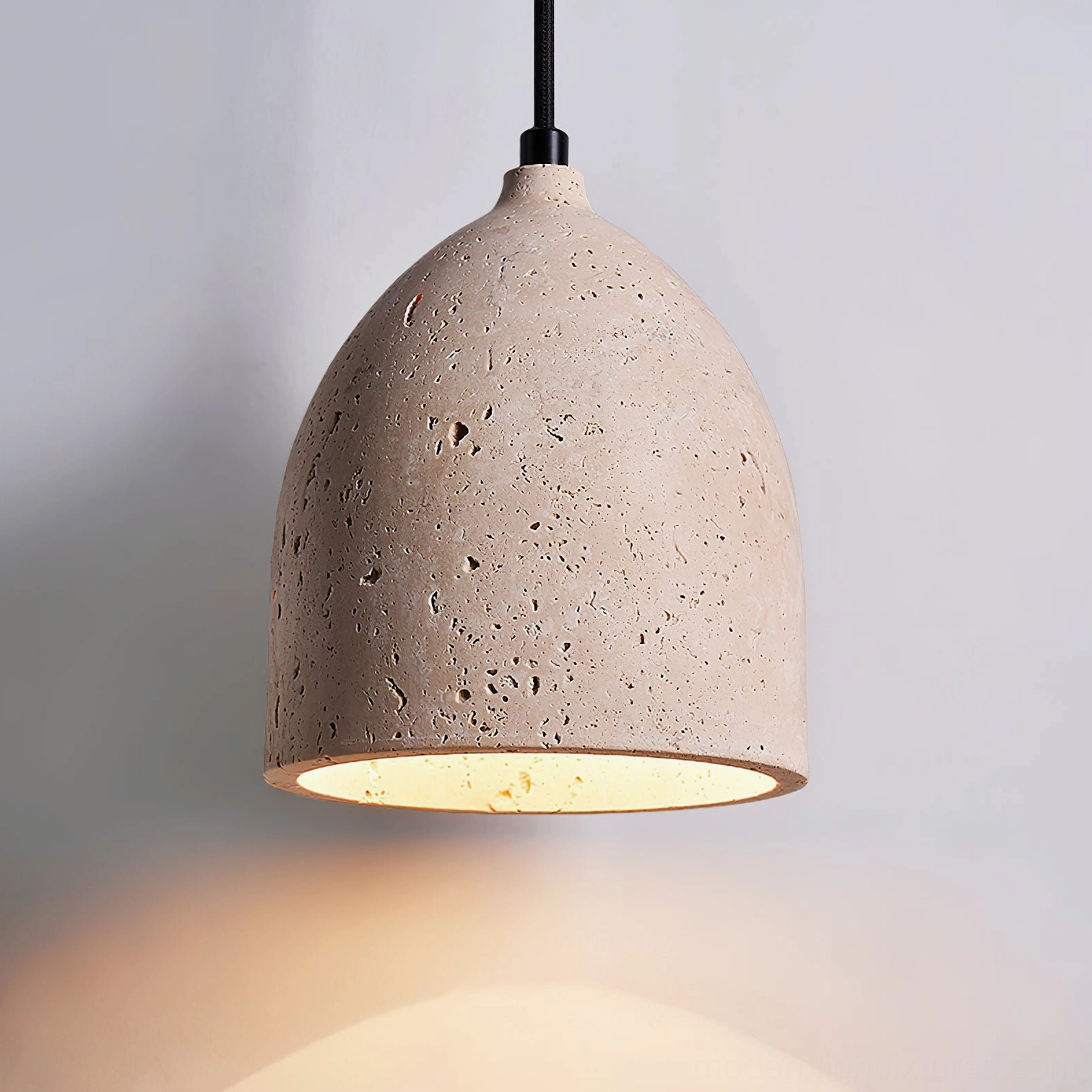 Contemporary travertine pendant lamp showing minimalist dome form and organic design aesthetic