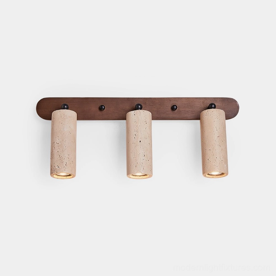 Ricerca 3-head travertine wall sconce with walnut wood backplate front view on white background showing cylindrical stone diffusers