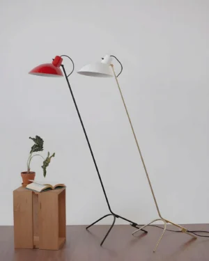 Two modern tripod floor lamp variants displayed side by side, black-red and gold-white color options, home setting