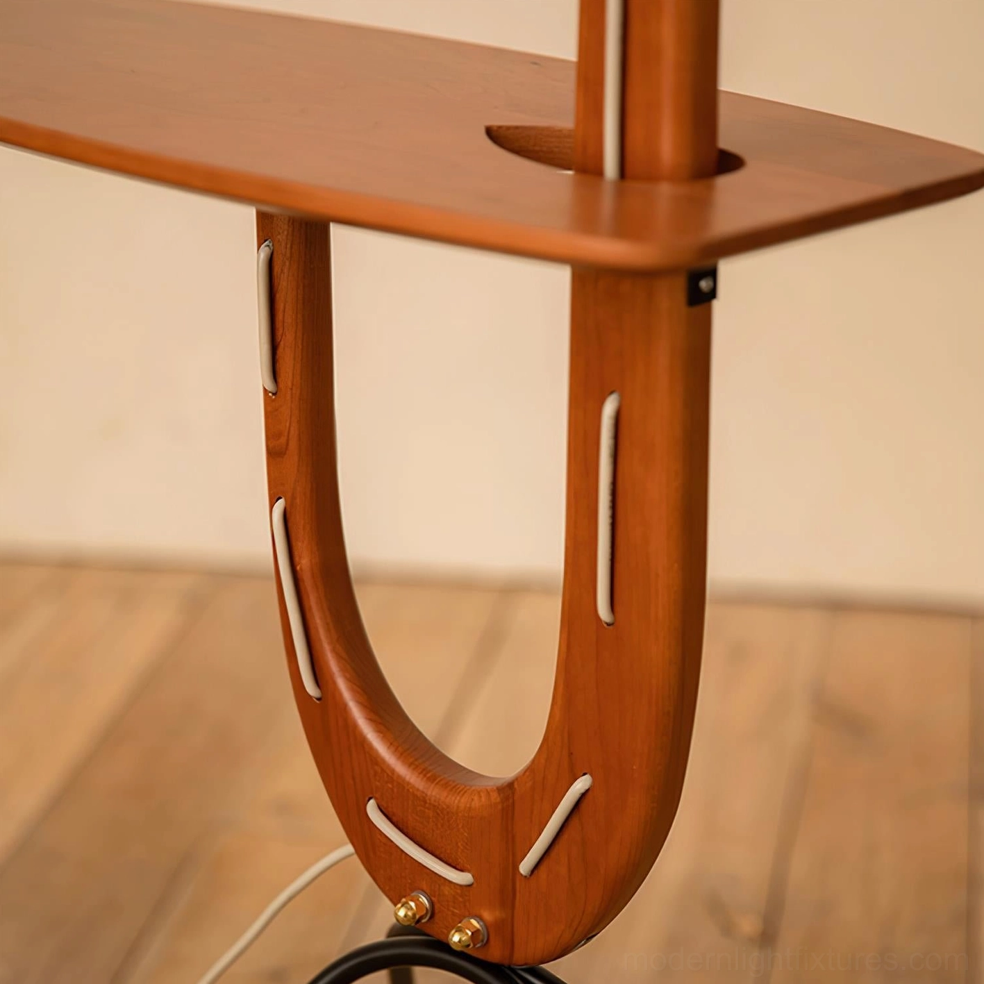 Modern tripod floor lamp with wood construction and side shelf functional furniture piece