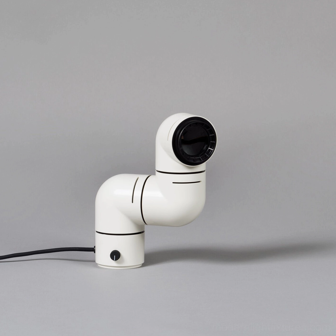 White matte finish tubular table lamp side view with black trim and rotary base switch