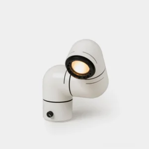 Industrial tubular table lamp front three-quarter view with matte white finish and black accents on studio background