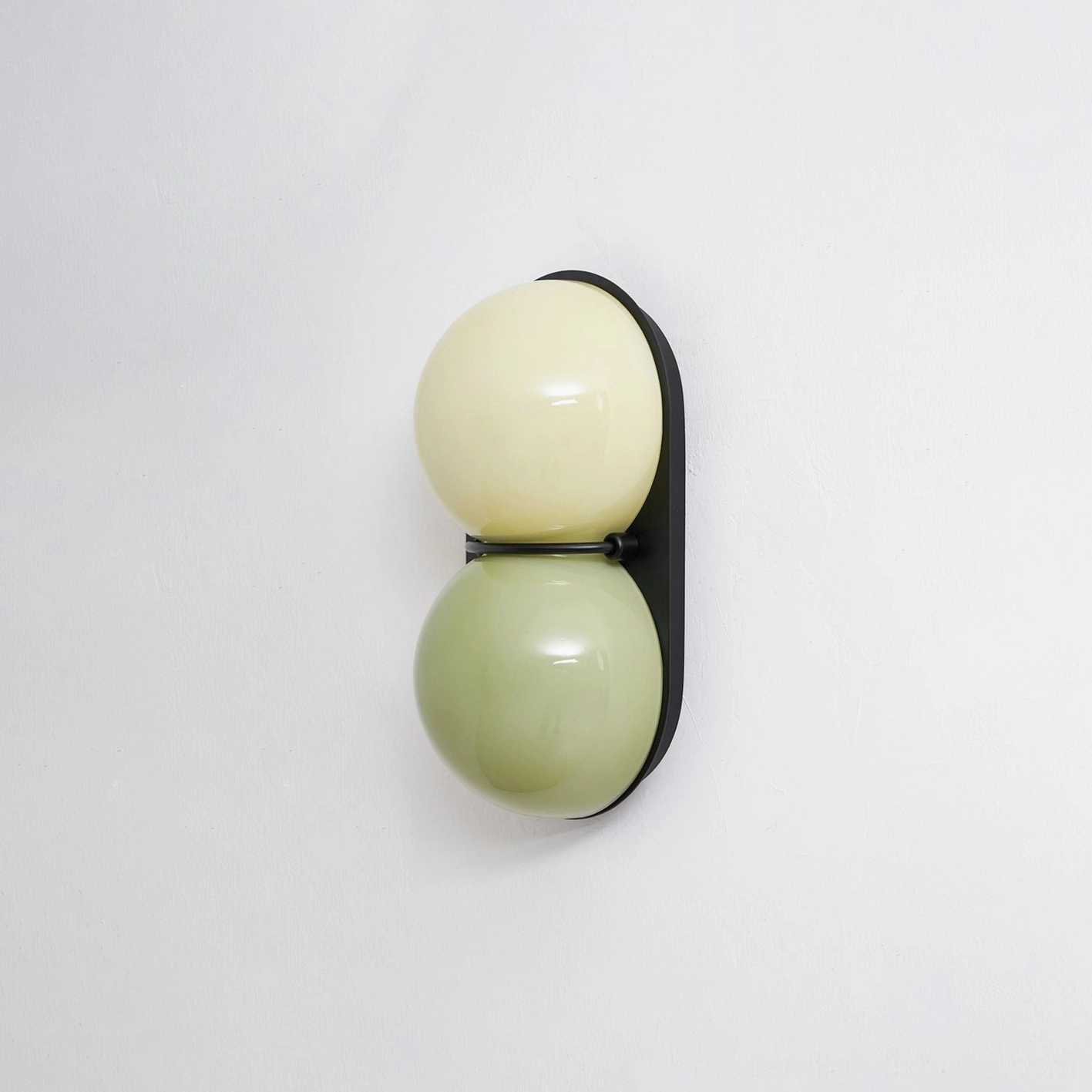 Modern Twinwave double globe wall light sconce in contemporary residential space with warmth