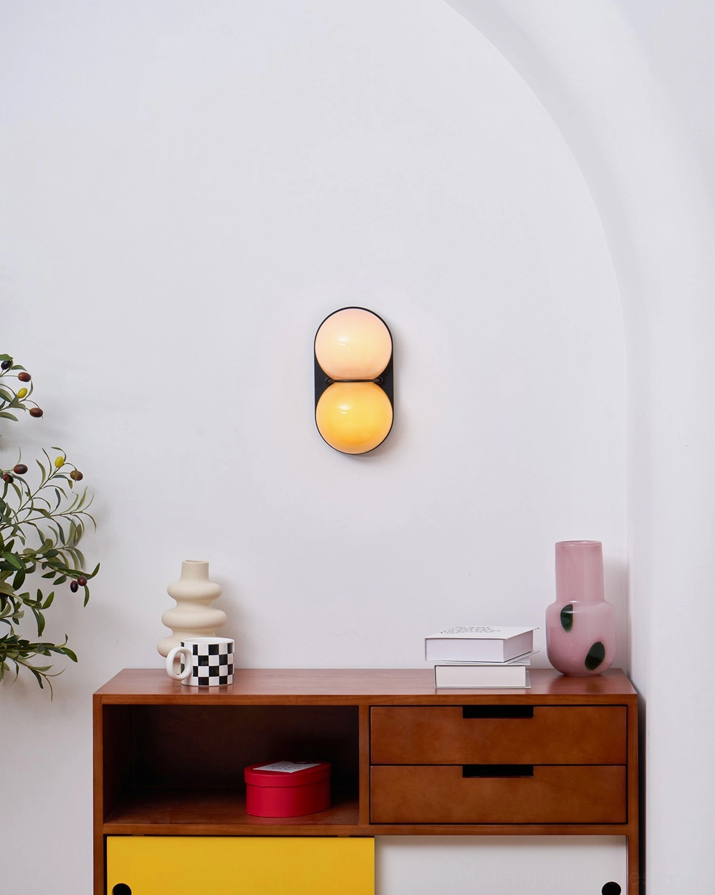 Modern Twinwave double orb wall light sconce in contemporary residential interior design