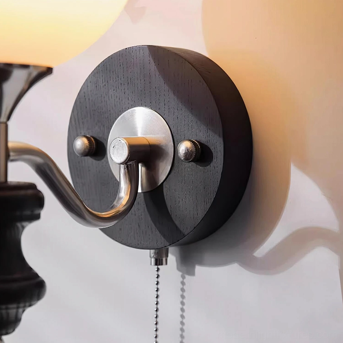 Modern interpretation of vintage wall sconce with spherical frosted glass diffuser