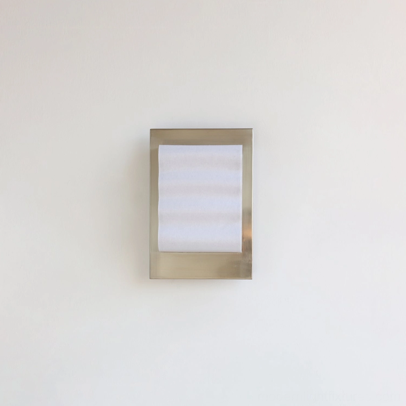 Flat panel modern wall sconce with brushed silver metal frame and horizontal texture milky shade studio shot