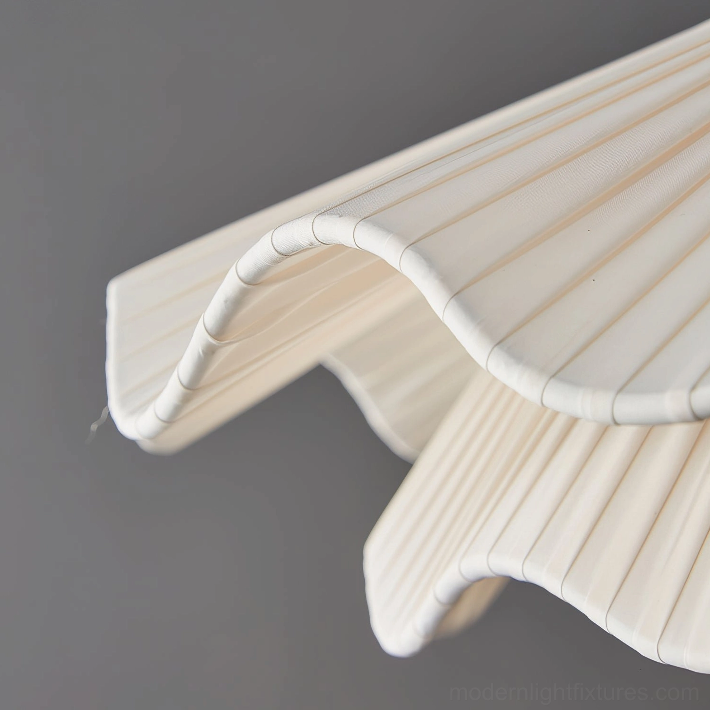 Contemporary sculptural pendant light in open concept modern home with minimalist furnishings