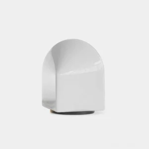 Modern minimalist house-shaped ceramic table lamp with white gloss finish and black base, frontal studio view