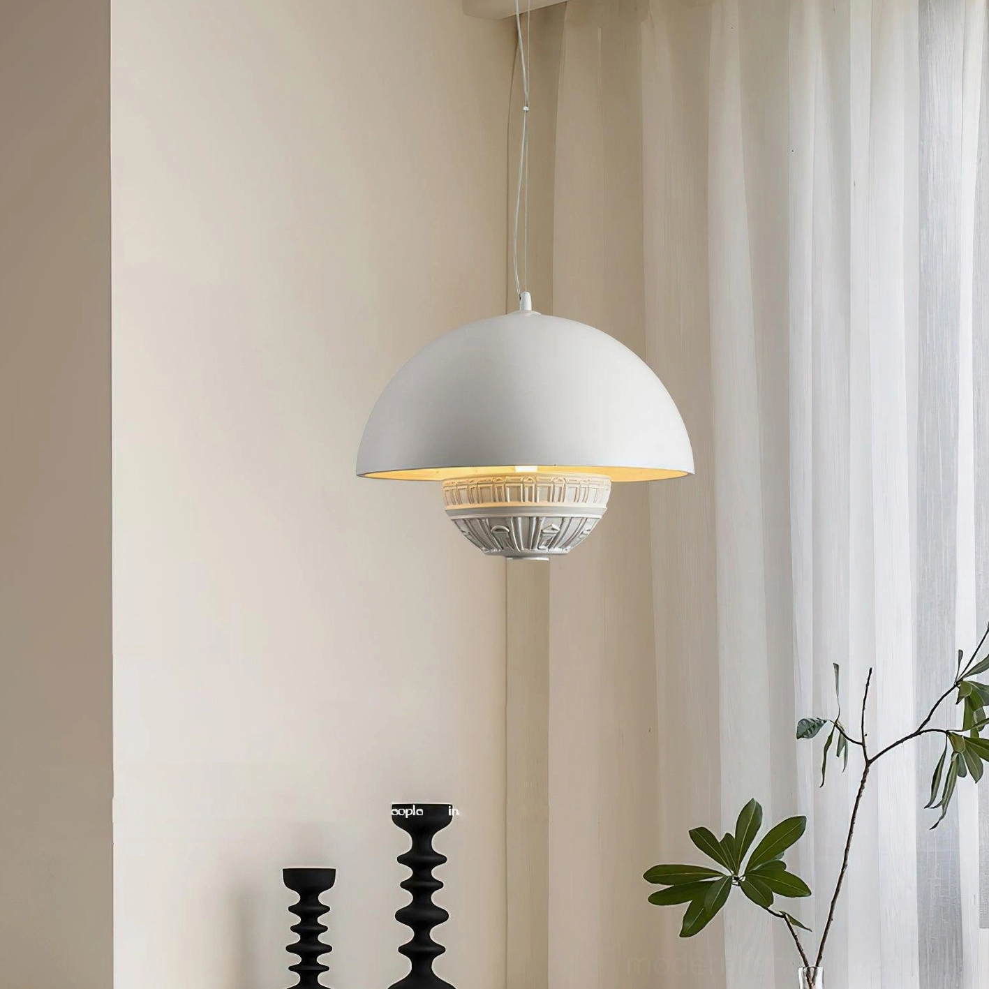 Ofelia white pendant lamp three-quarter side view in minimalist living room with warm glow