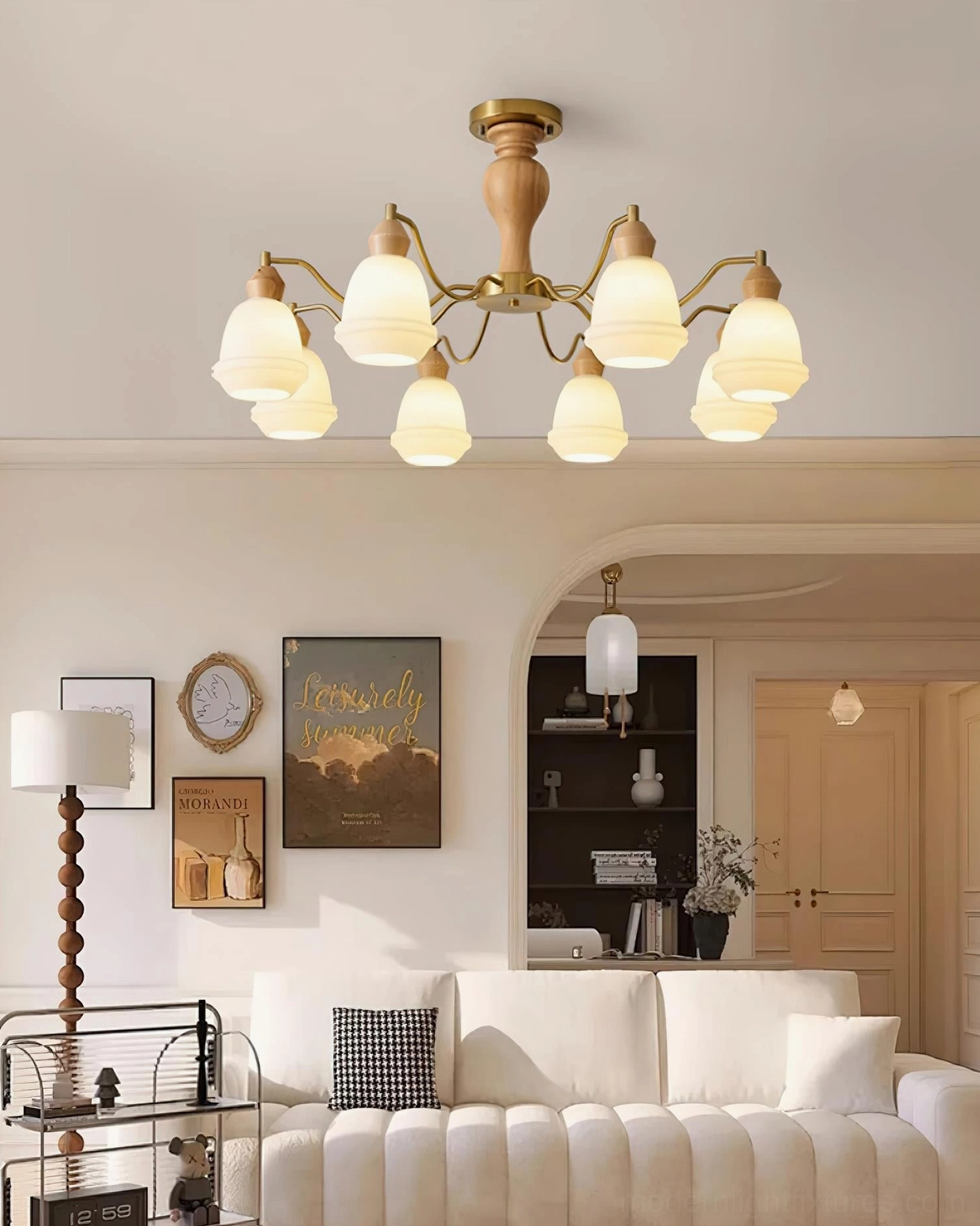 Modern wood chandelier fixture with curved brass arms overhead view