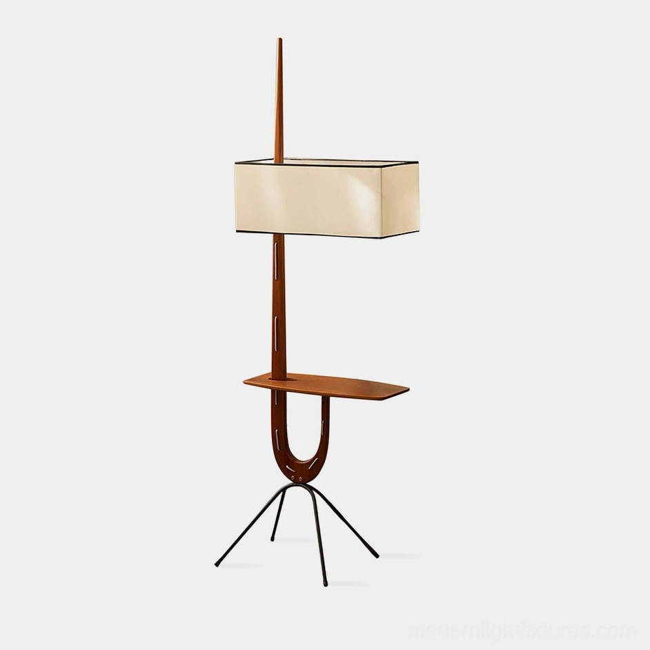Mid-century modern wood floor lamp with tripod base and integrated side shelf, walnut color, front studio view