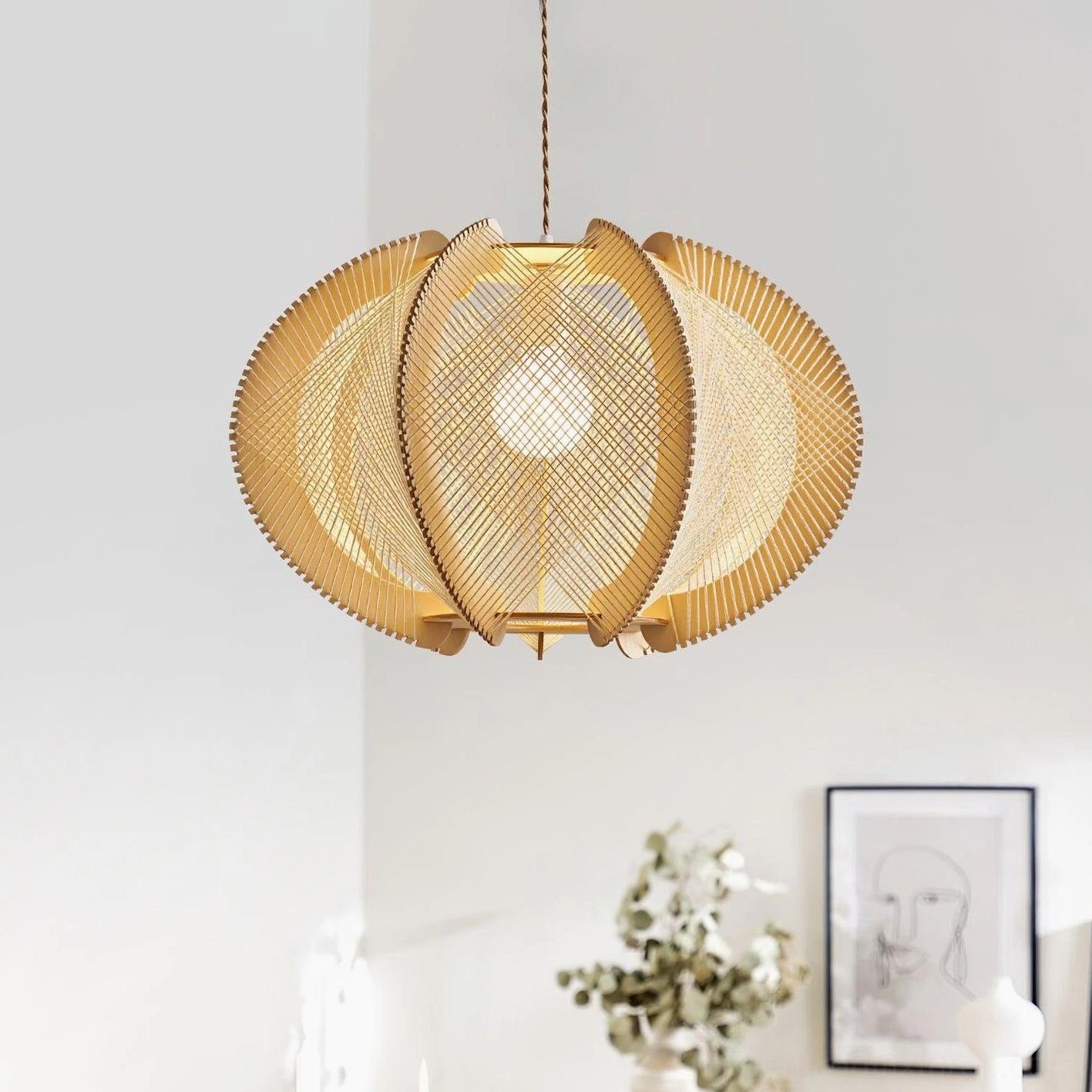 Woven wood pendant light mounted in spacious modern living space high ceiling