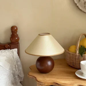 Natural wood table lamp with fabric shade displayed in cozy home setting, modern table lamp for interior design