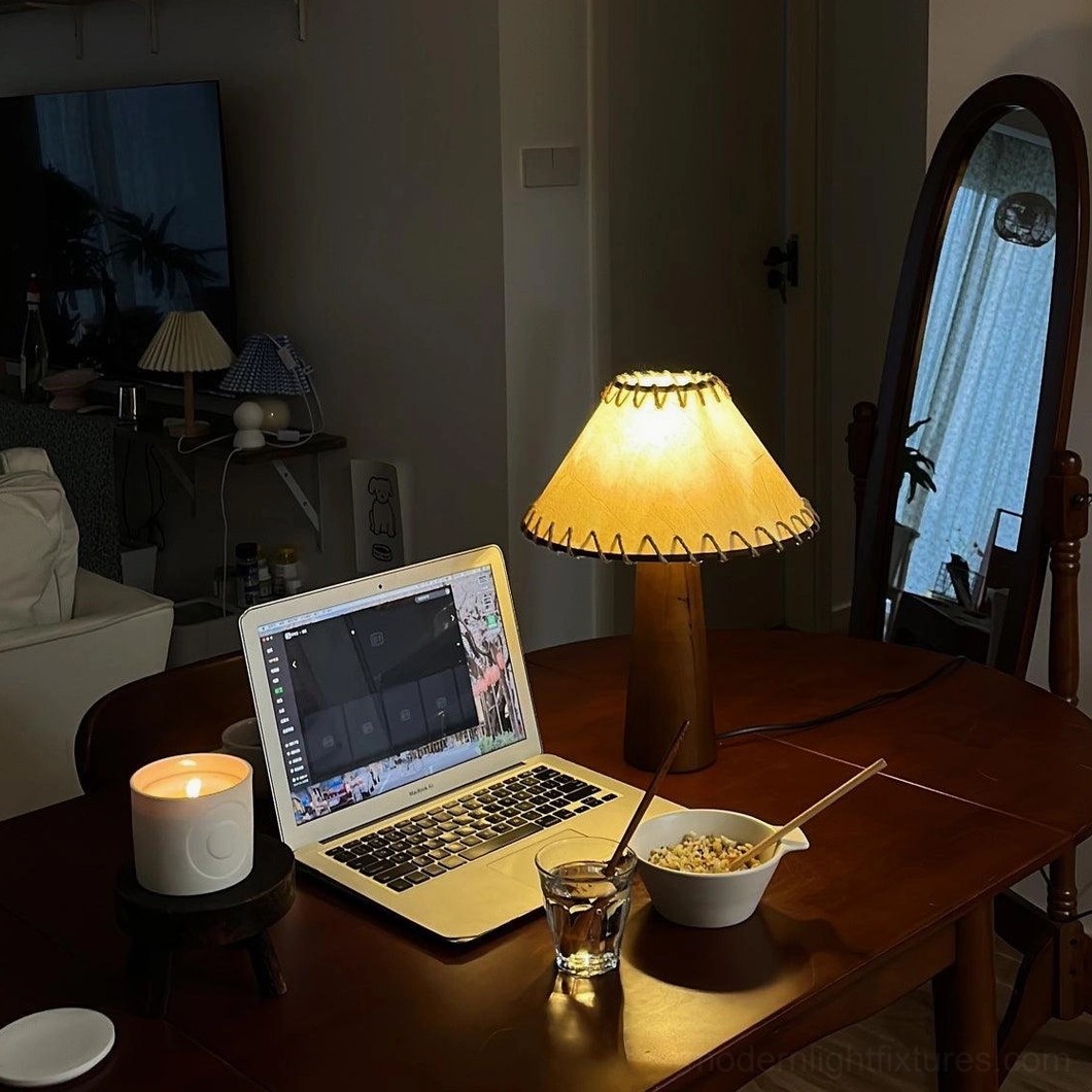 Modern wood table lamp with natural jute fabric shade in minimalist interior setting with contemporary furniture