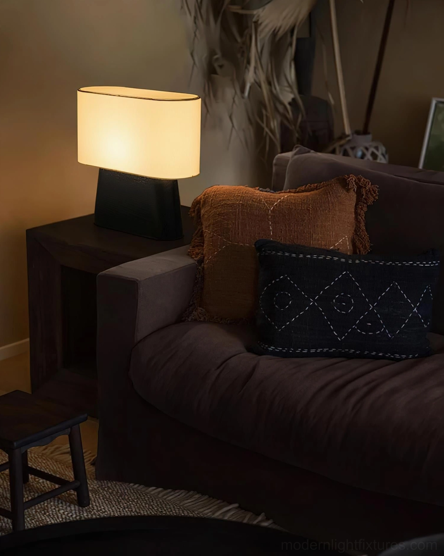 Modern table lamp with neutral fabric shade and natural wood base, front studio photography