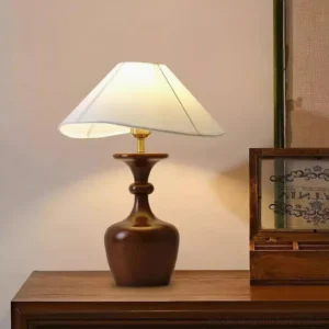 Modern wood table lamp three-quarter angle on vintage wooden side table