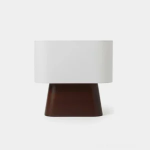 Modern wood table lamp with white fabric shade and dark brown tapered wooden base, front studio view