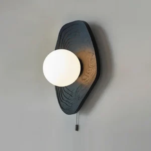 Minimalist wood wall sconce three-quarter perspective showing organic wood grain and frosted glass shade