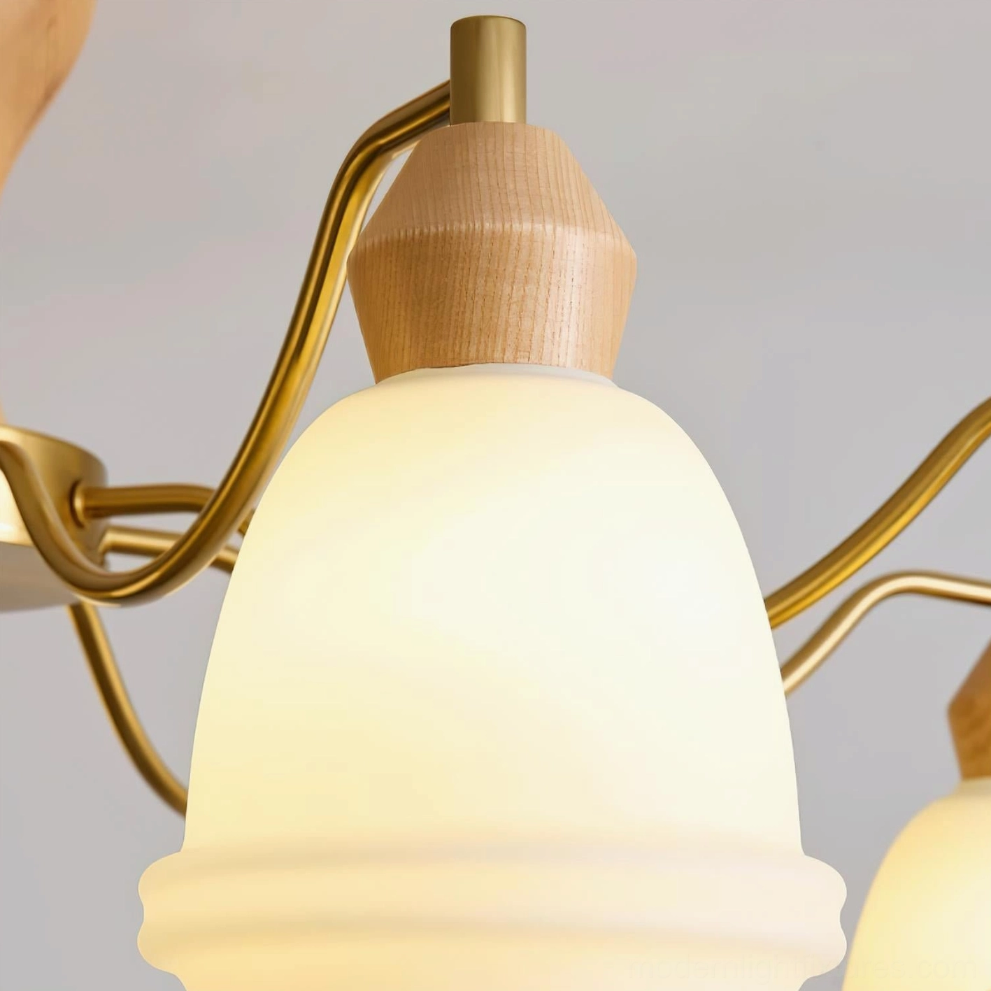 Modern wooden chandelier fixture showing fine craftsmanship and curved metal arms