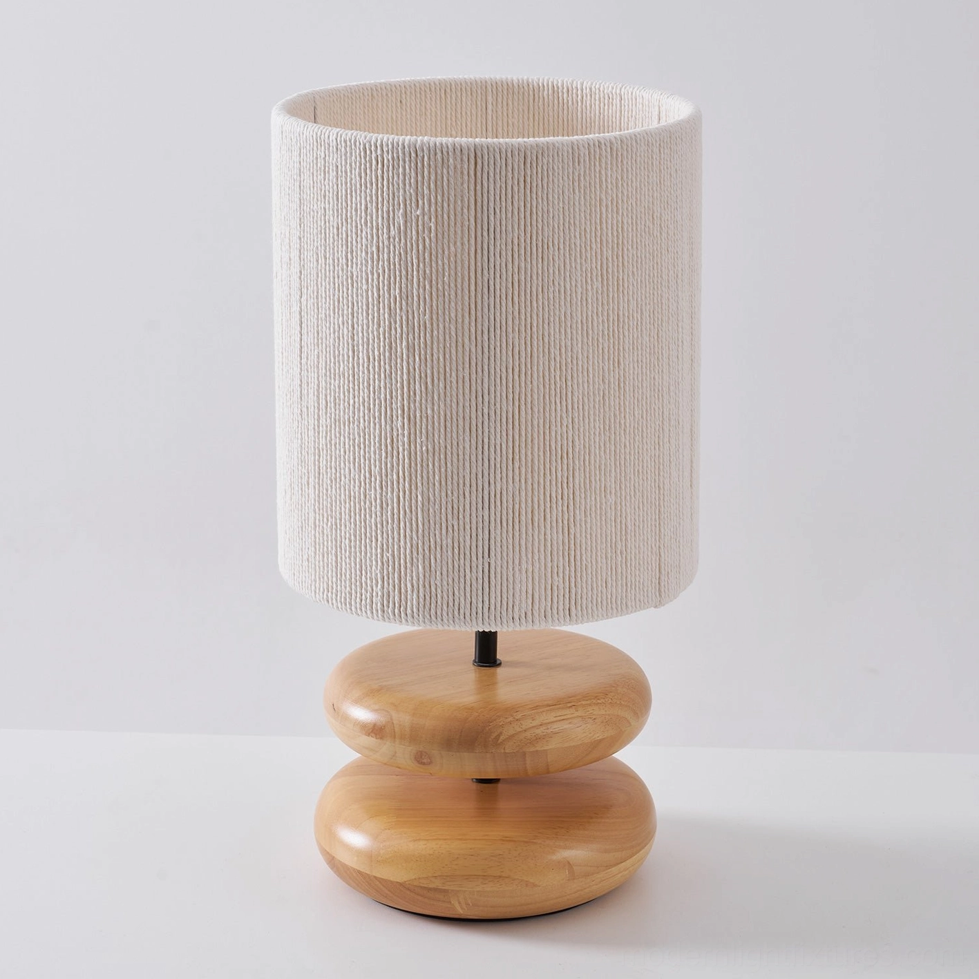 Modern wooden table lamp featuring stacked oval design and premium construction