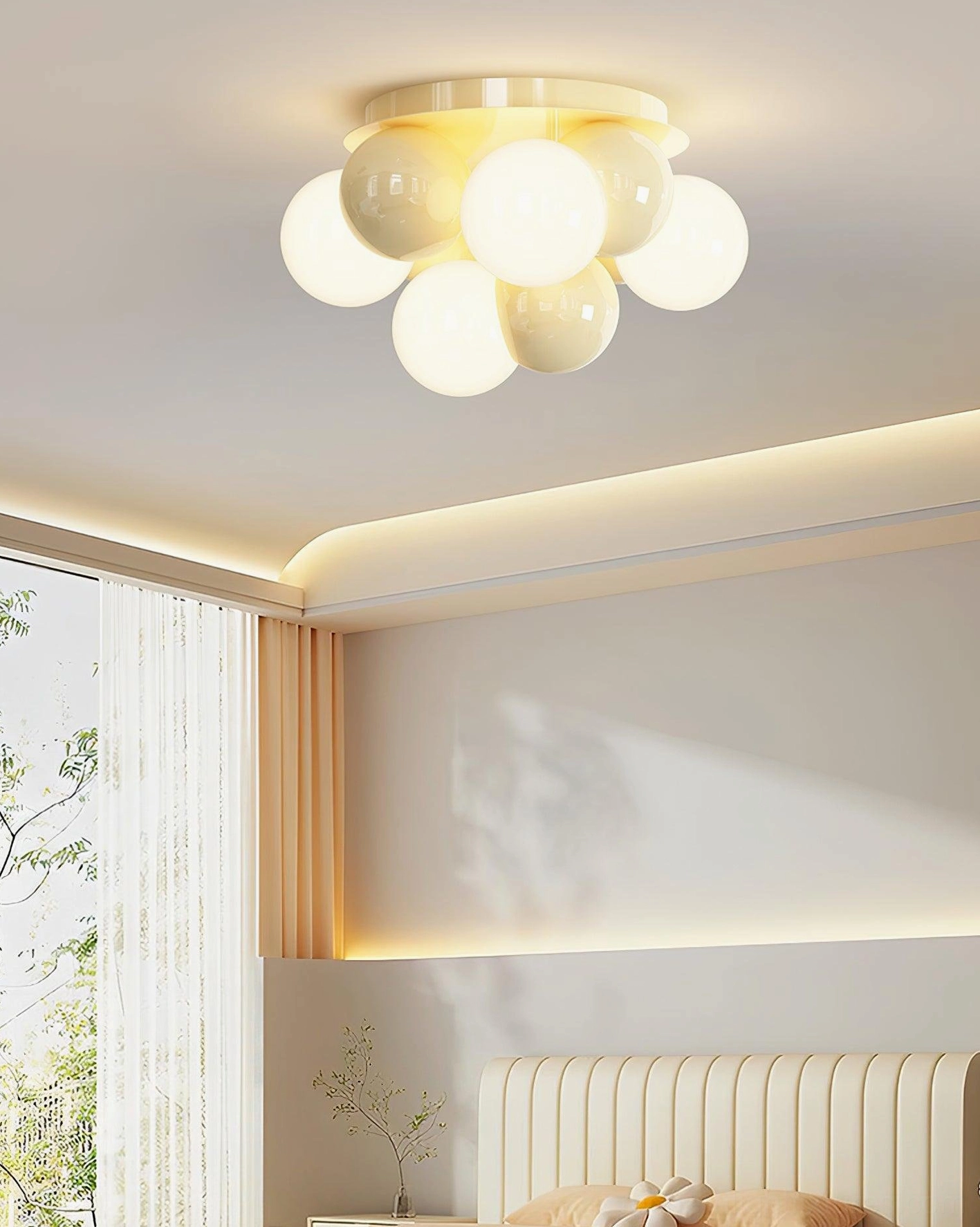 Bedroom with large window illuminated by Modo Bubble cream glass globe ceiling light