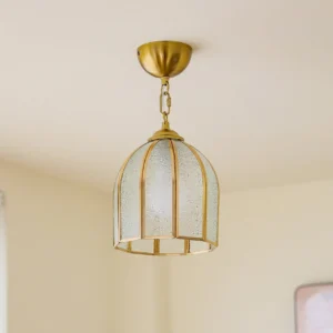 Moire frosted glass ceiling fixture in brass with overhead three-quarter angle view