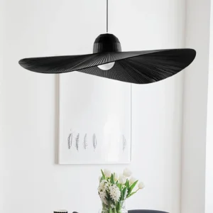 Moire Hat Pendant Light installed in modern dining area with three-quarter view showing pleated fabric construction and exposed bulb