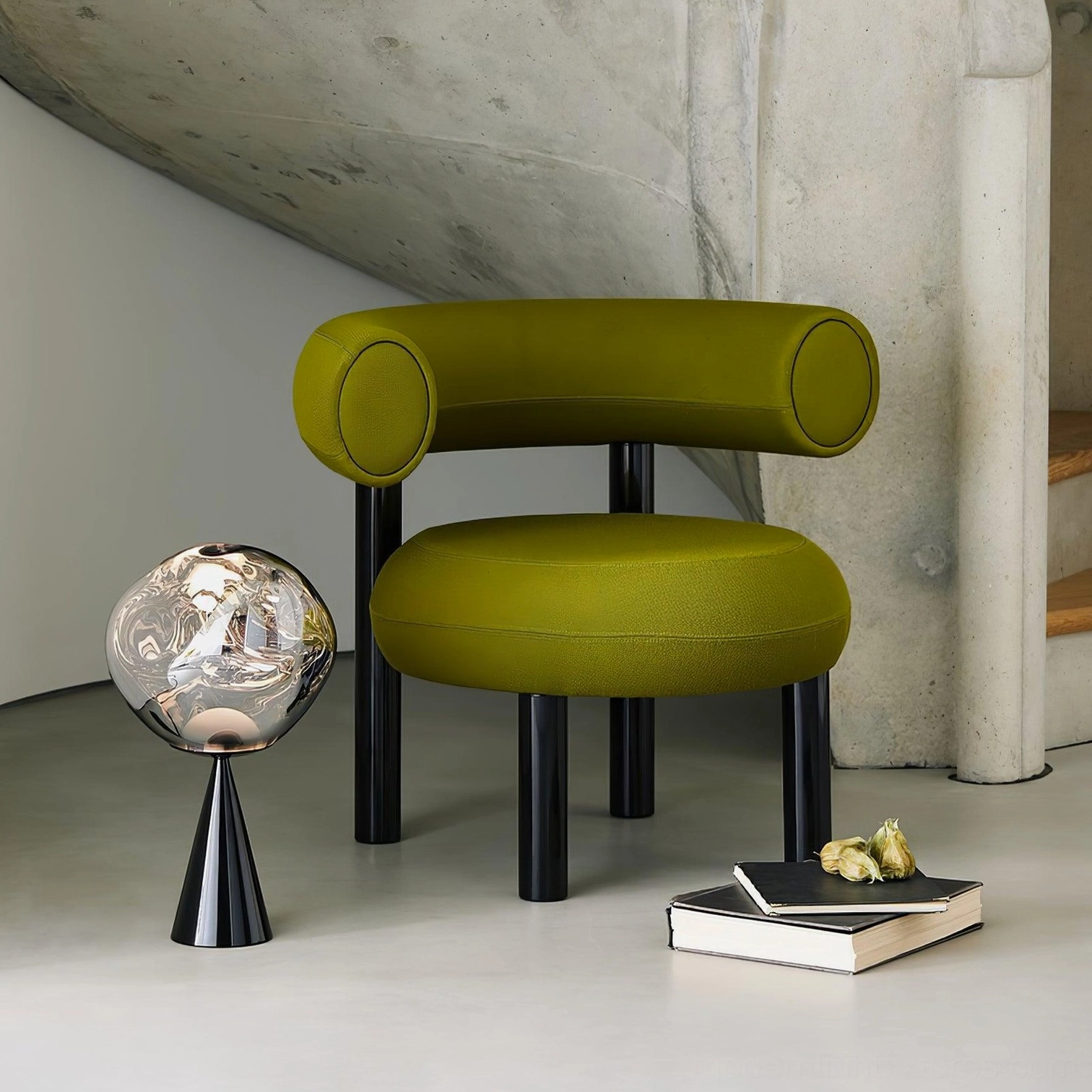 Modern sculptural molten cone lamp black base modern living room corner with green chair accent