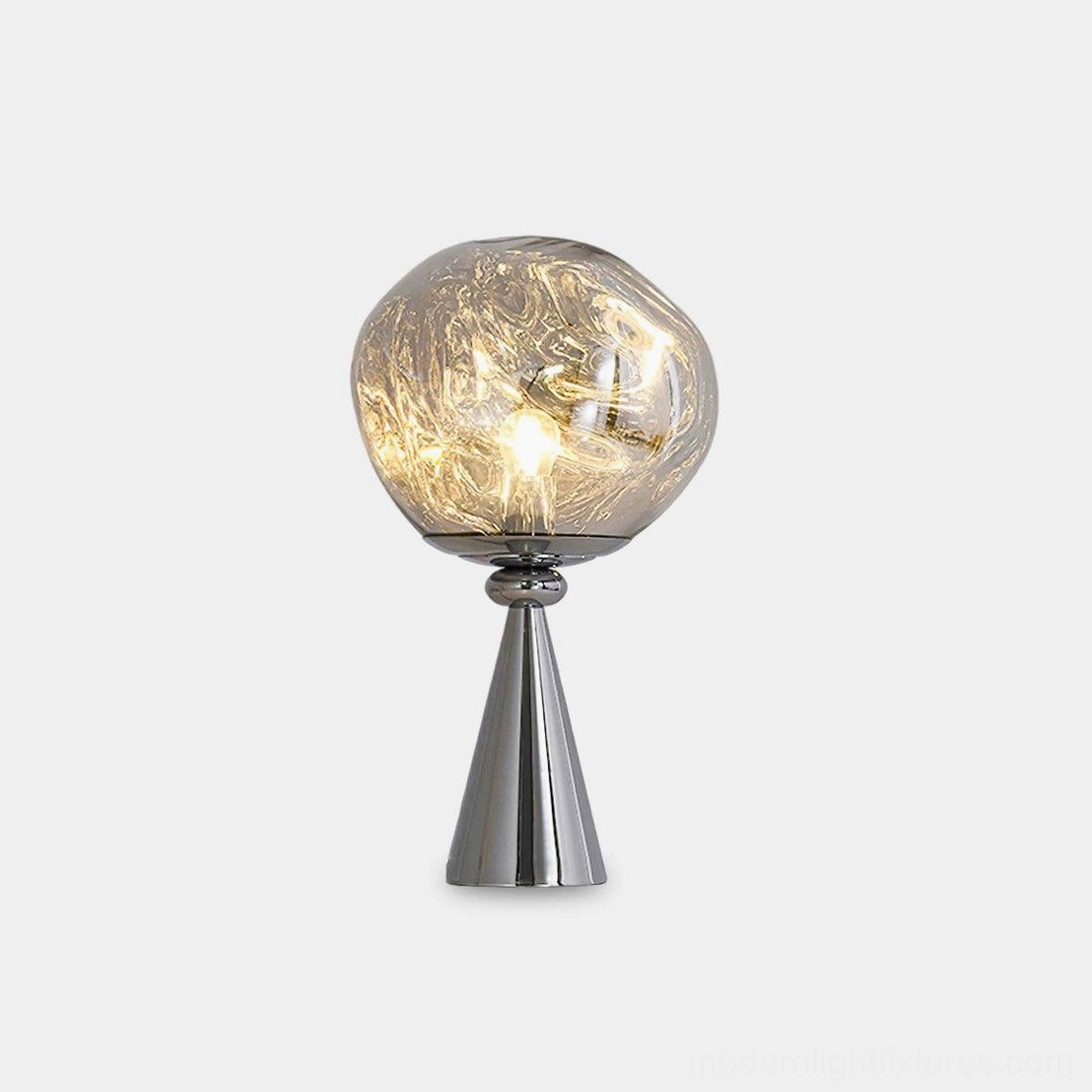 Molten glass cone lamp studio white background silver base warm glowing smoked glass shade