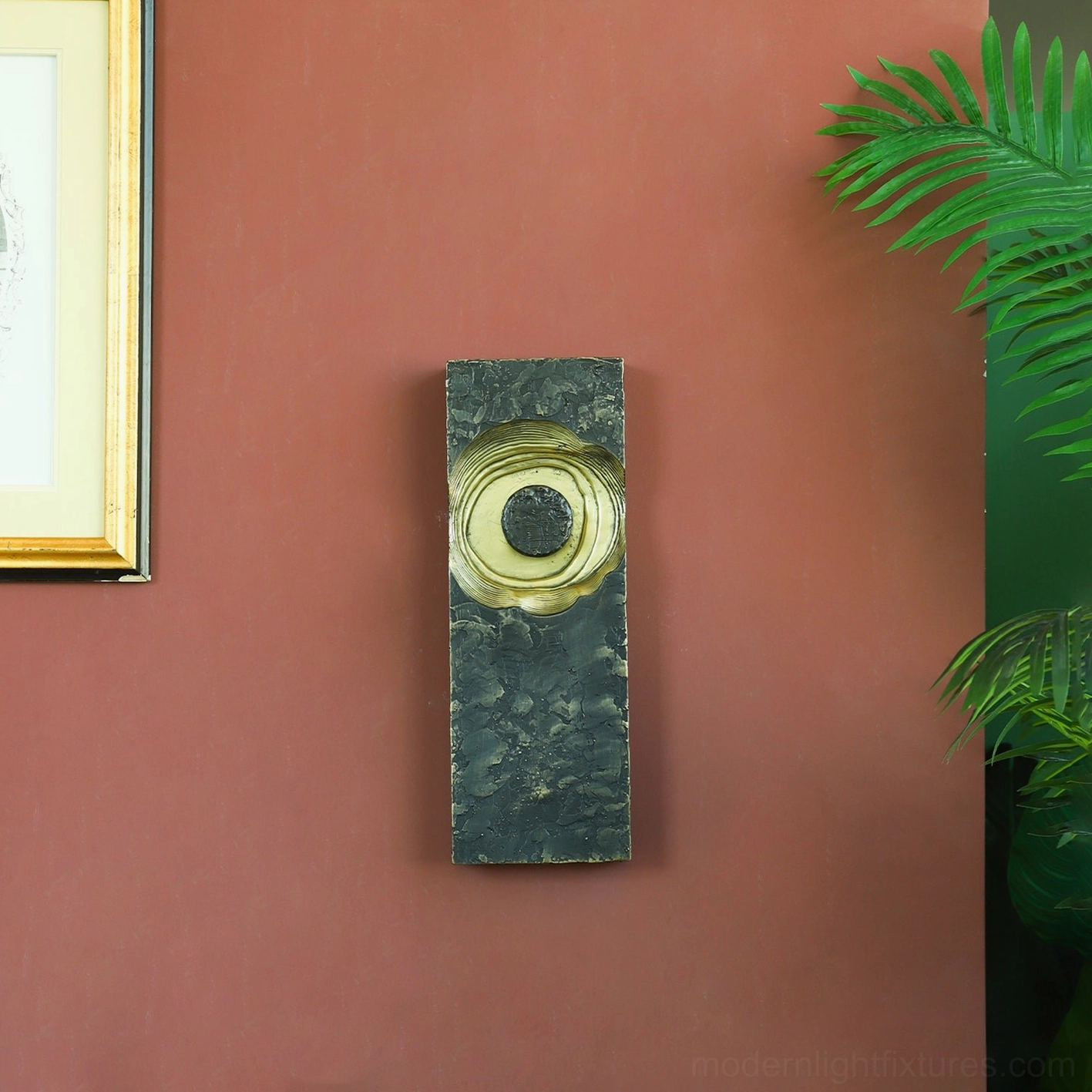 Moltena black wall sconce artistic detail, hand-formed molten metal exterior with distressed black textured finish