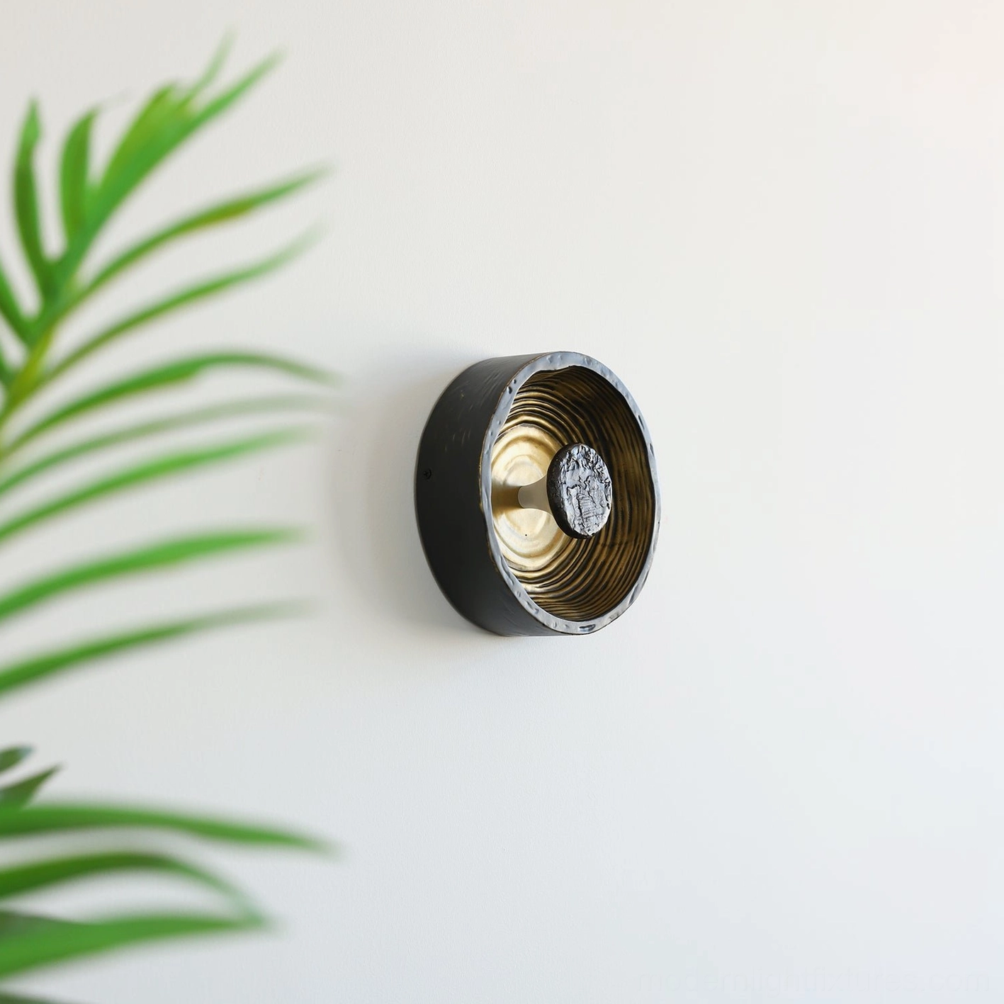 Moltena contemporary black wall sconce, sculptural design with organic flowing form and artisanal hand-crafted aesthetic