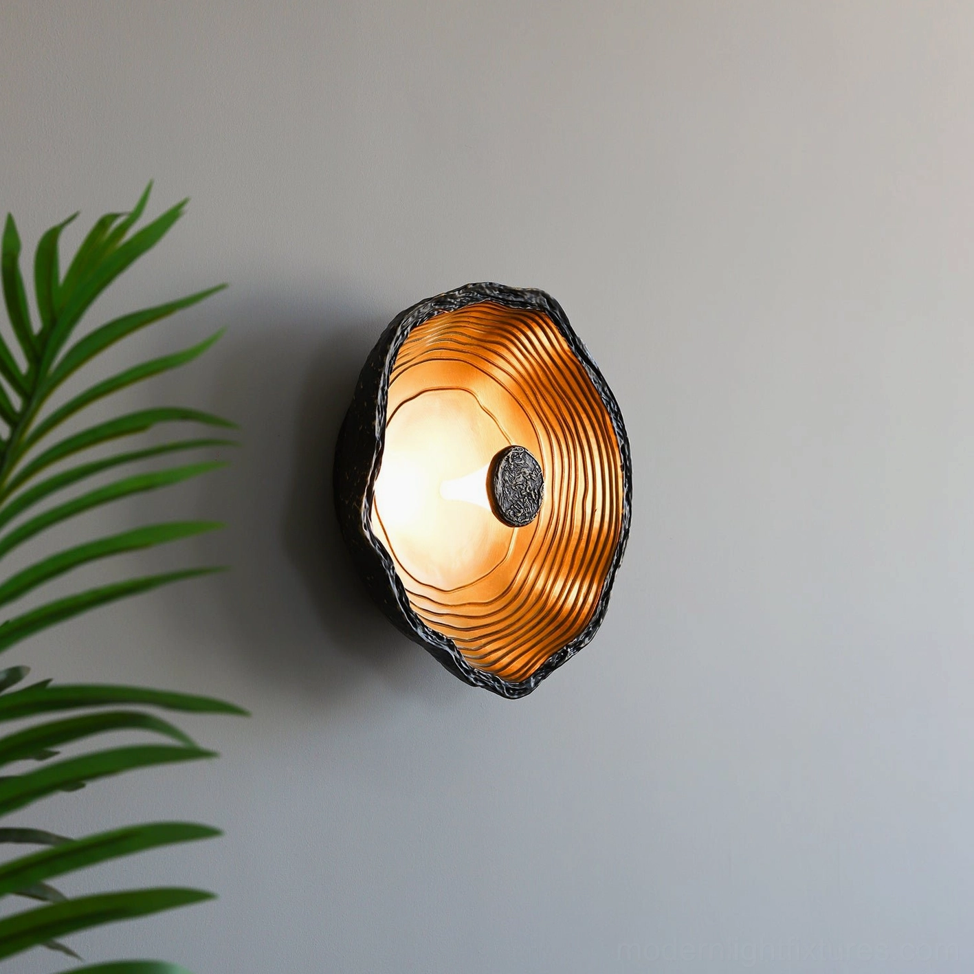 Moltena industrial-minimalist wall sconce, metal and brass construction with 50,000 hour integrated LED lifespan