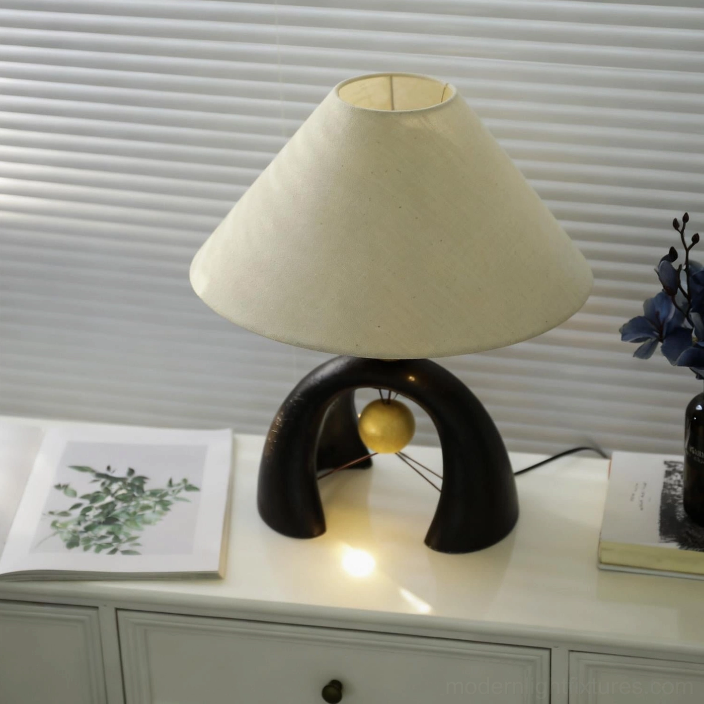Mono Arch contemporary table lamp showcasing minimalist design with geometric arched base and fabric shade