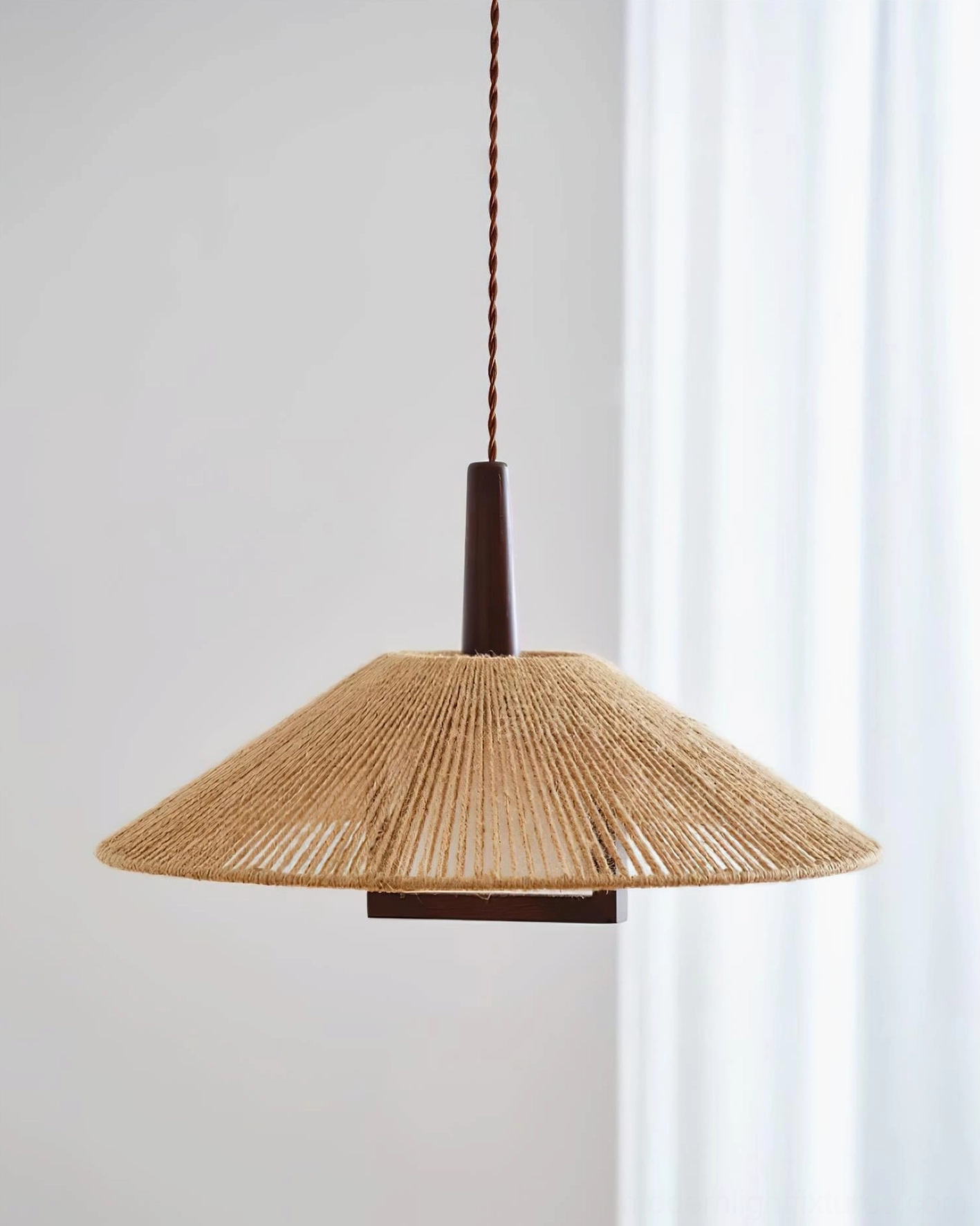 Mons hemp rope pendant fixture side profile showing open hollow base and woven shade detail
