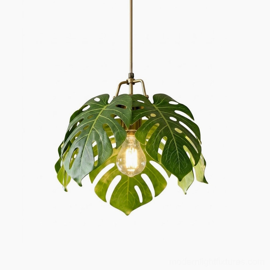 Monstera leaf pendant light showing polished brass suspension rod and sculptural leaf frame construction