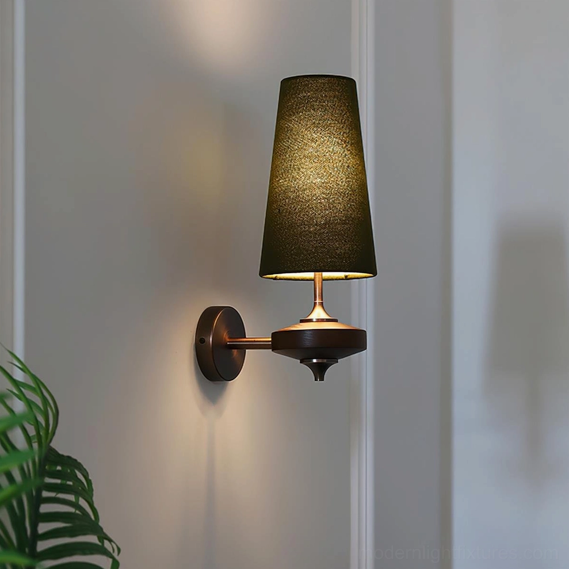 Montera wall sconce in bathroom vanity setting showing damp-rated design and symmetrical placement