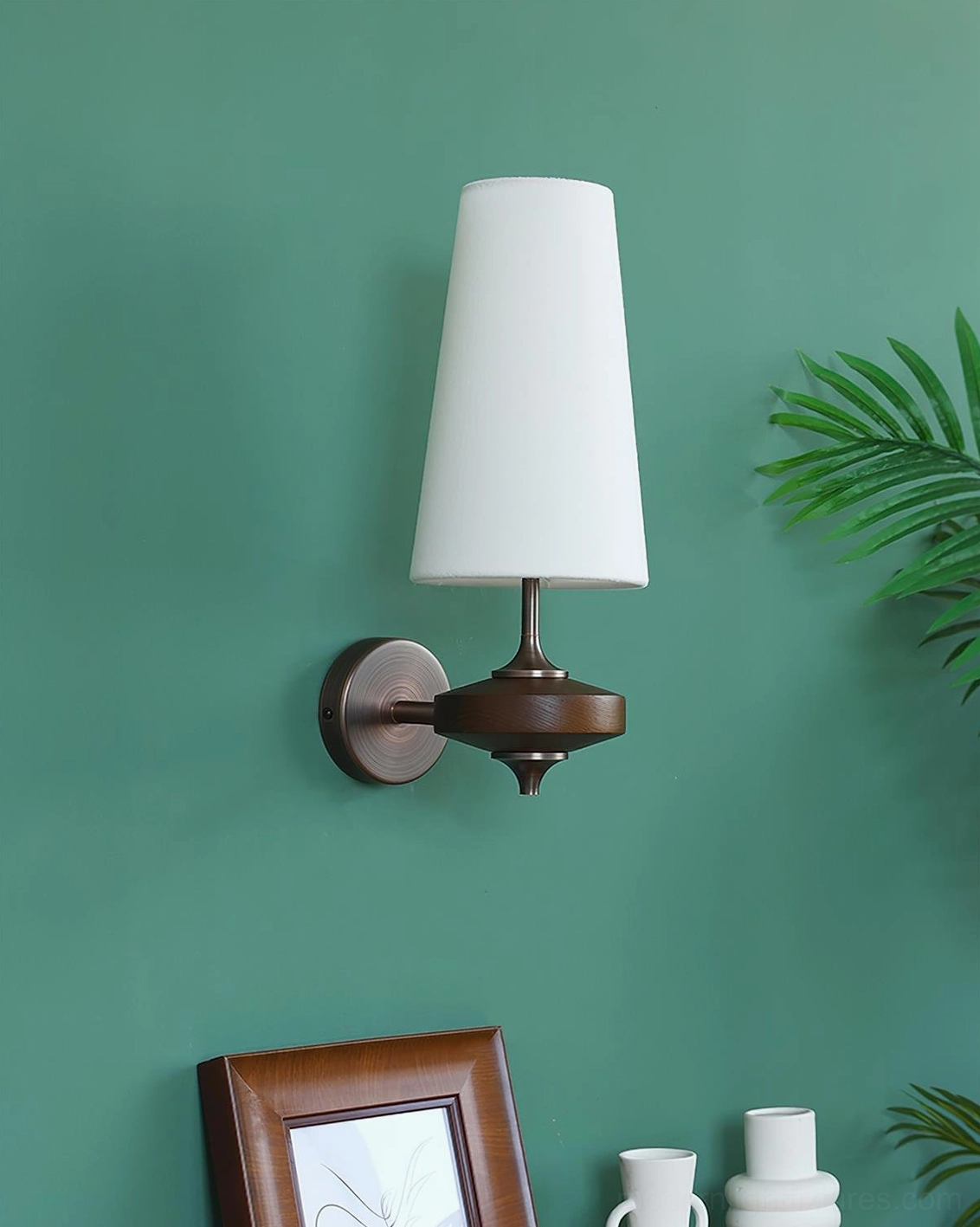 Montera conical wall sconce in various color options and finishes displayed in modern interior setting